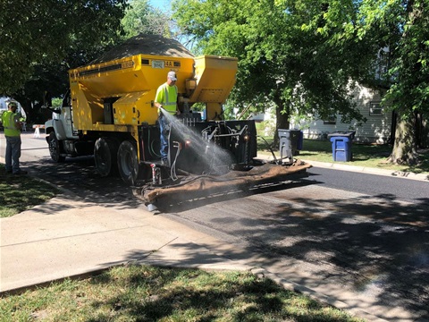 City-employees-applying-slurry-seal-to-street.jpg