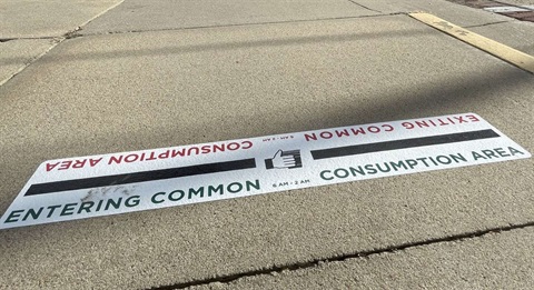 Common Consumption Area sidewalk markings in Hays